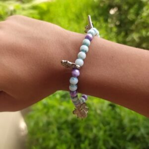 A Blue And Purple Bracelet With Ornaments
