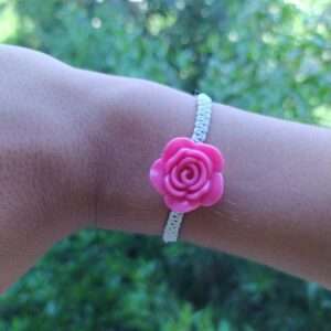 A White Braided Bracelet With Rose