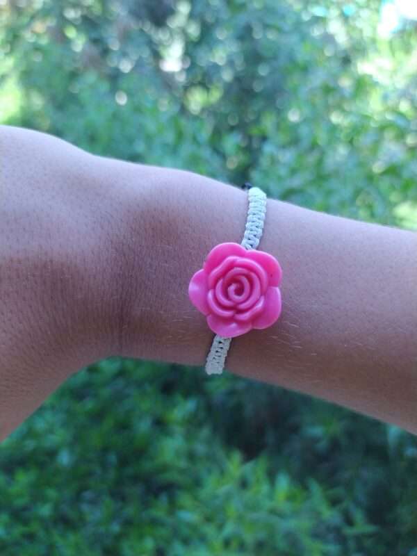 A White Braided Bracelet With Rose