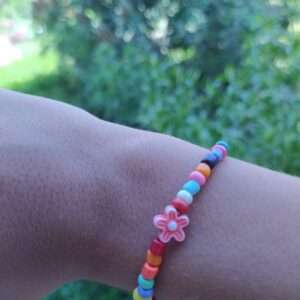 A Colourful Bracelet With A Flower