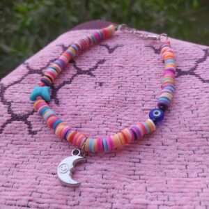 A Colourful Anklet With An Eye And An Ornament
